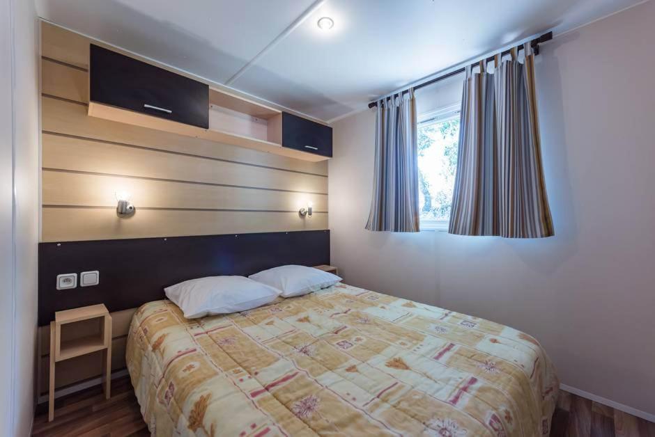 Postel nebo postele na pokoji v ubytování L'Oasis