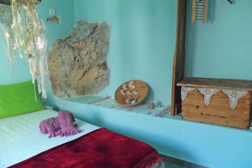 A bed or beds in a room at Traditional house Utopia Makri Gialos