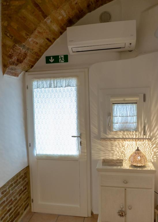 Kuchyň nebo kuchyňský kout v ubytování B&B Alexander