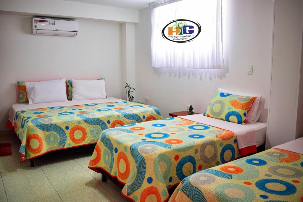 Postel nebo postele na pokoji v ubytování Hotel Getsemaní BGA