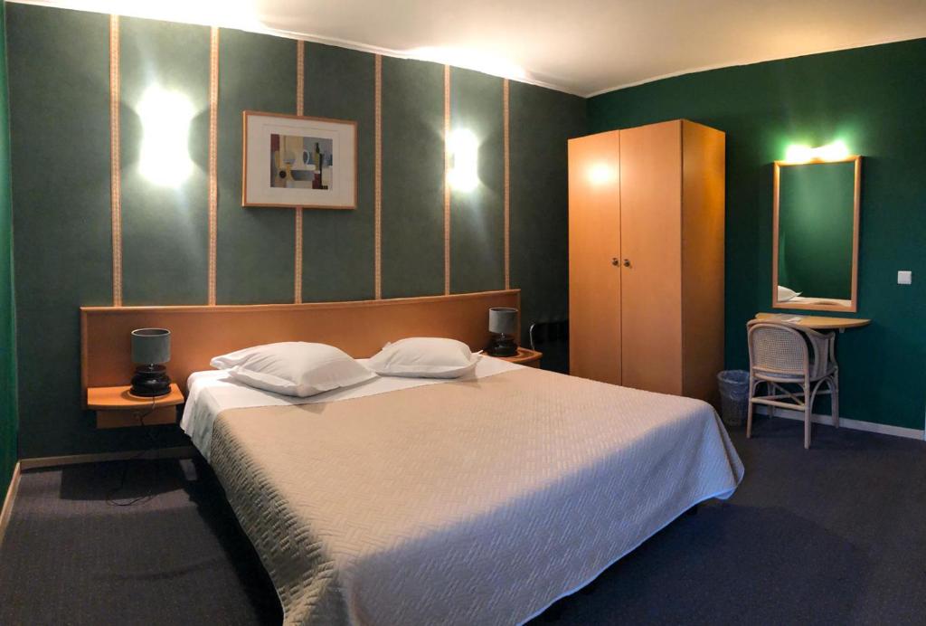 Postel nebo postele na pokoji v ubytování Hotel In Den Hoek