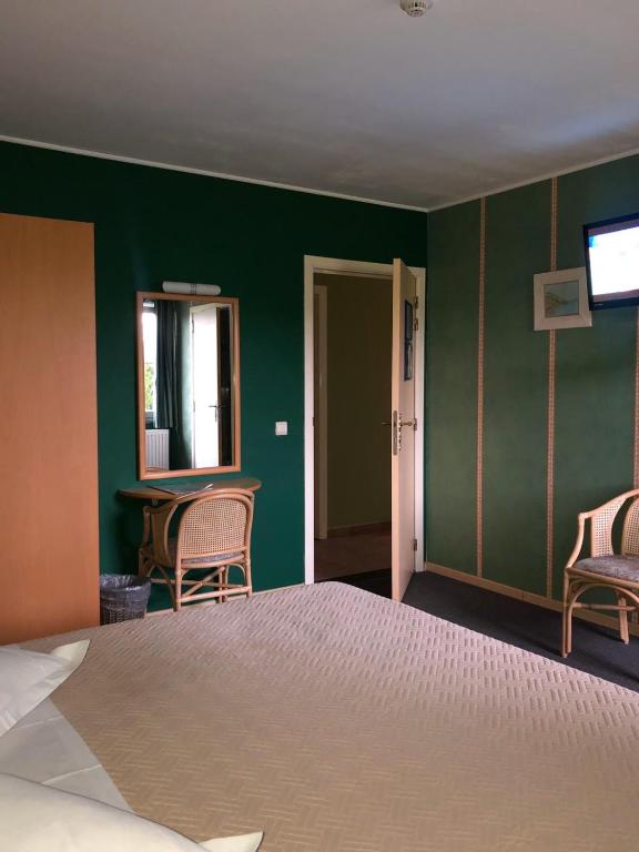 Postel nebo postele na pokoji v ubytování Hotel In Den Hoek