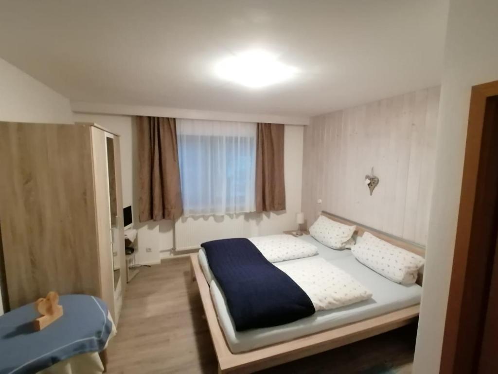 Postel nebo postele na pokoji v ubytování Gästehaus Pöppl