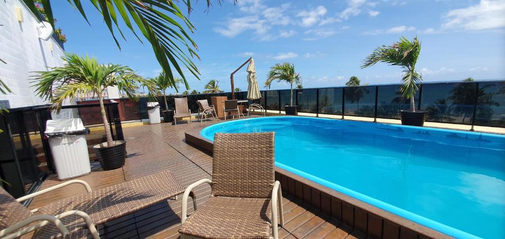 a swimming pool on the roof of a building at Mar do Cabo Branco Beira Mar in João Pessoa
