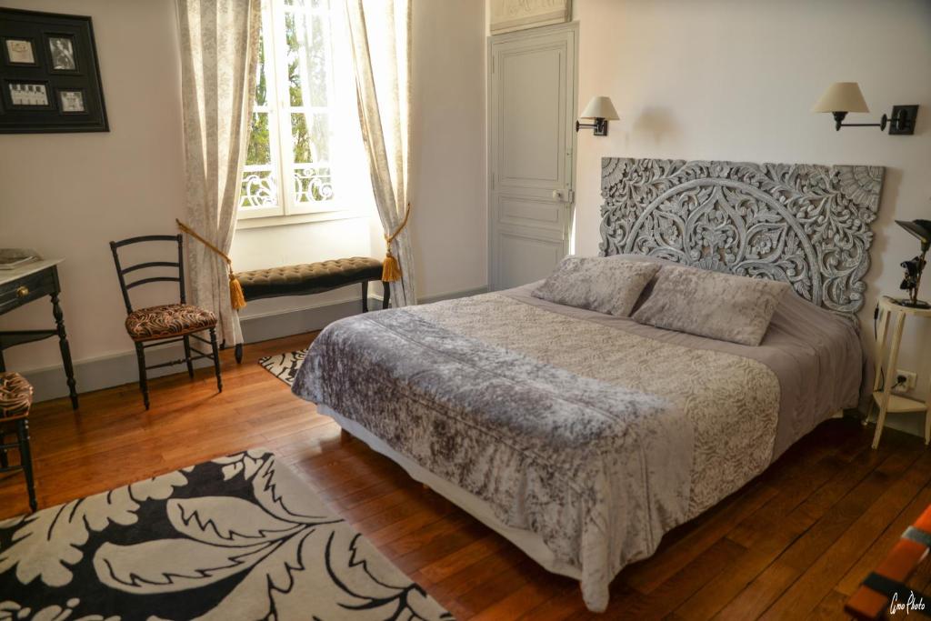 Postel nebo postele na pokoji v ubytování L'Oustal