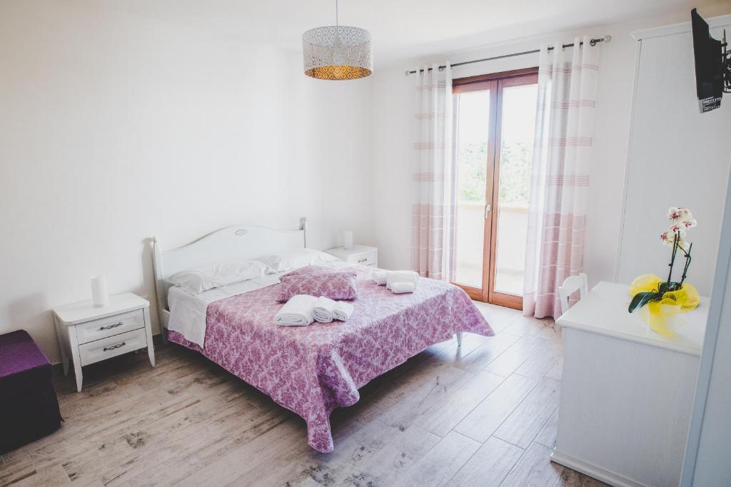 Postel nebo postele na pokoji v ubytování Stella Fenicia