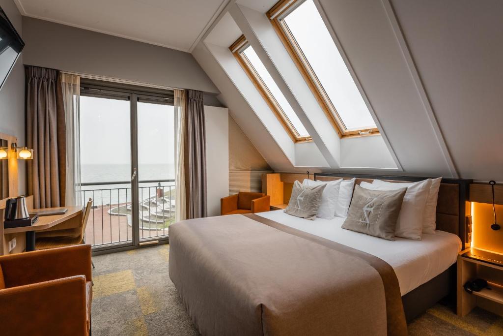 Postel nebo postele na pokoji v ubytování Hotel Zeezicht