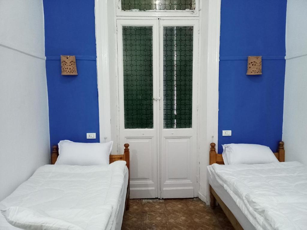 Postel nebo postele na pokoji v ubytování اللوكاندة الجديدة New Hotel