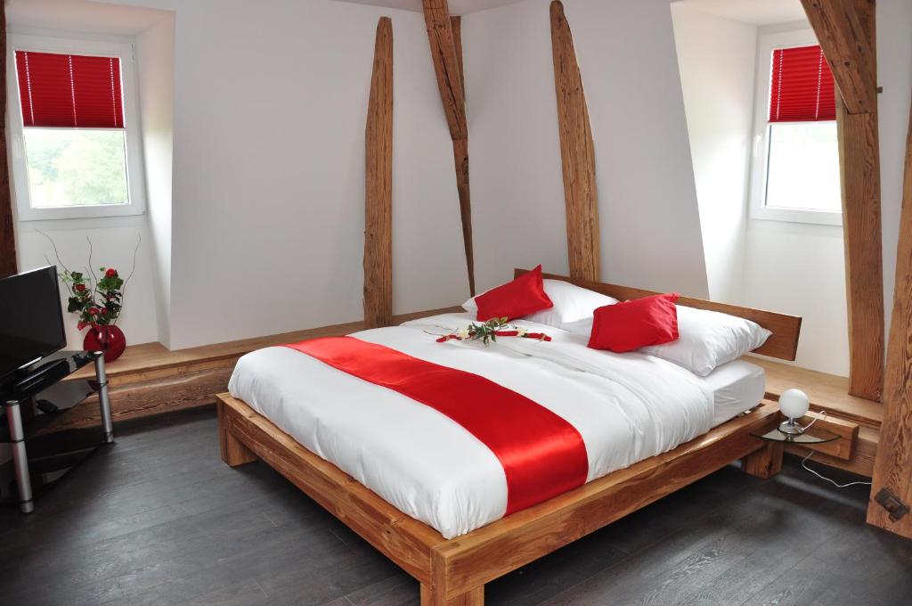 Postel nebo postele na pokoji v ubytování Le Relais du Château Monney