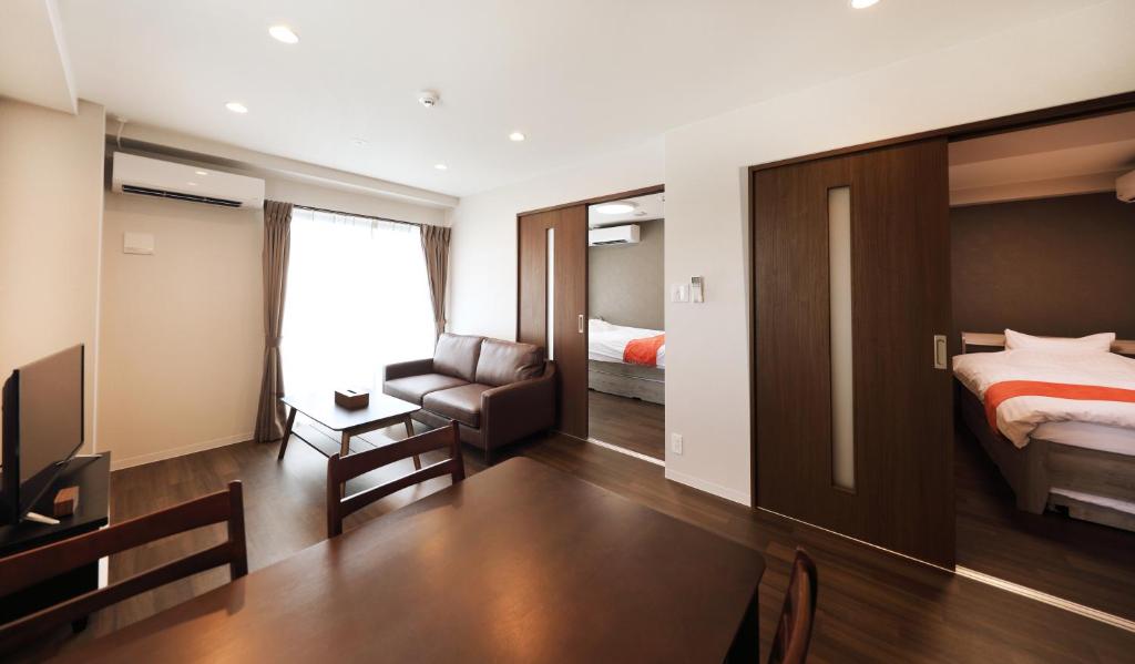Postel nebo postele na pokoji v ubytování Apartment Hotel Ecott