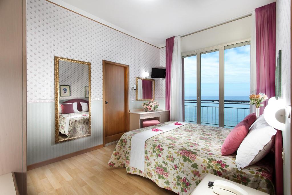 Postel nebo postele na pokoji v ubytování Hotel Sporting