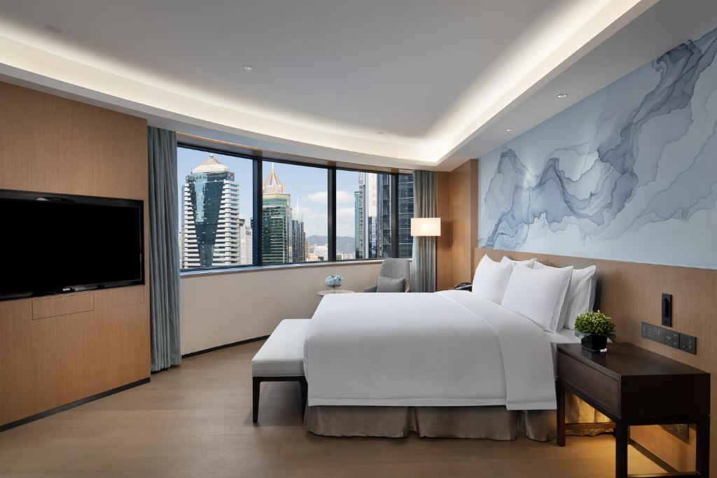 Postel nebo postele na pokoji v ubytování Foreign Trade Centre C&D Hotel,Fuzhou