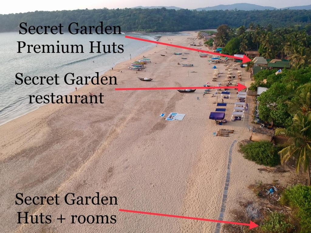 an aerial view of the beach with the names of the resorts at Secret Garden in Agonda