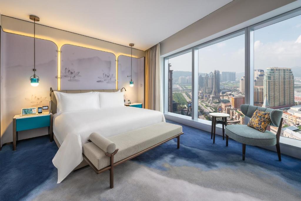 Postel nebo postele na pokoji v ubytování City of Dreams Macau - Nüwa Macau