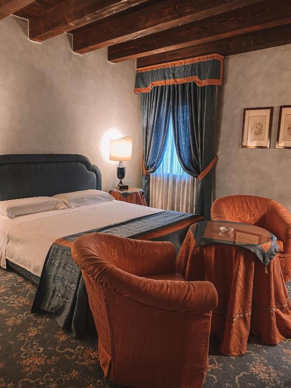 Posteľ alebo postele v izbe v ubytovaní Relais Villabella Hotel