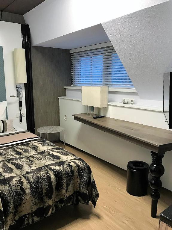 Postel nebo postele na pokoji v ubytování Hotel Woudschoten