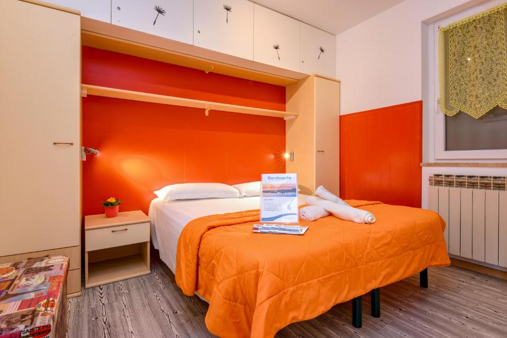 Postel nebo postele na pokoji v ubytování La Portella - Gardagate