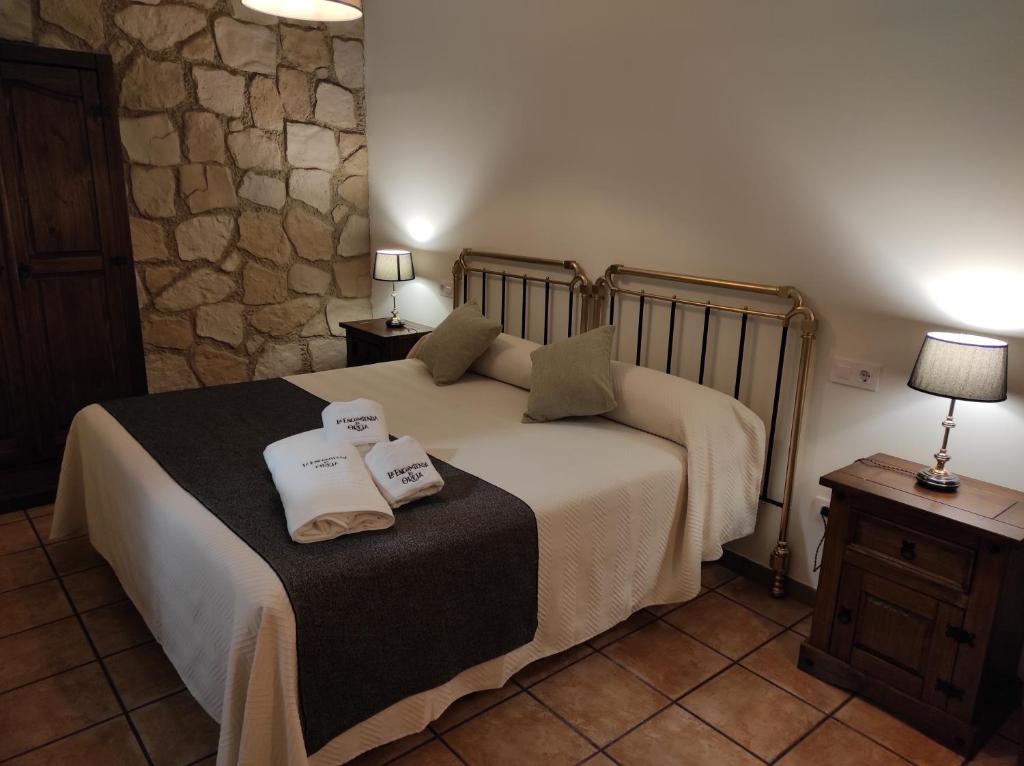 A bed or beds in a room at La Encomienda de Oreja