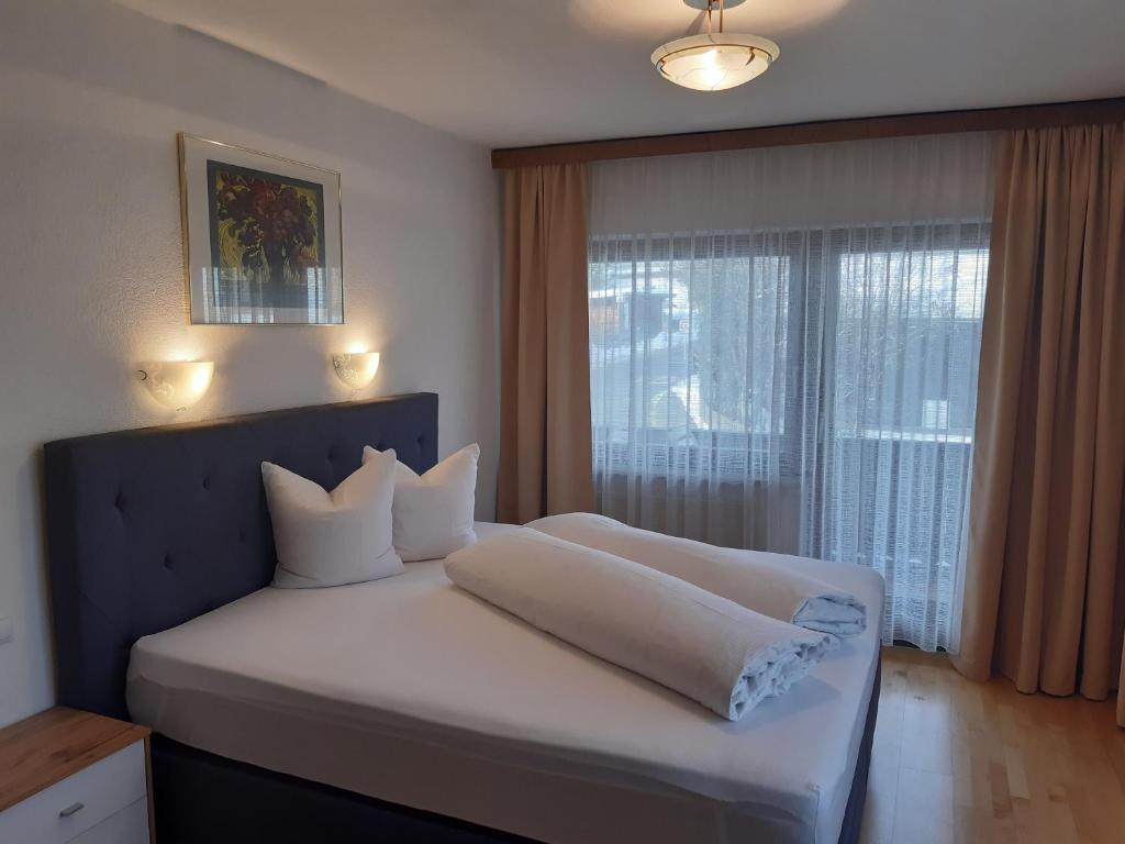 Posteľ alebo postele v izbe v ubytovaní Landhaus Klausnerhof Hotel Garni