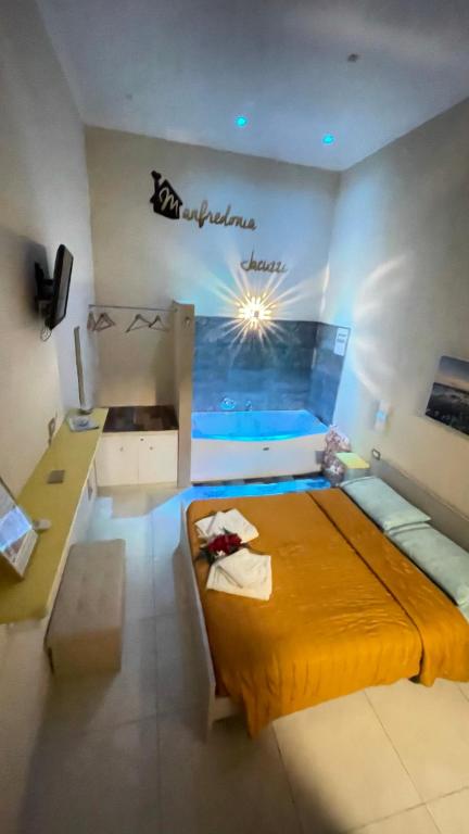 Postel nebo postele na pokoji v ubytování ManfredoniaJacuzzi