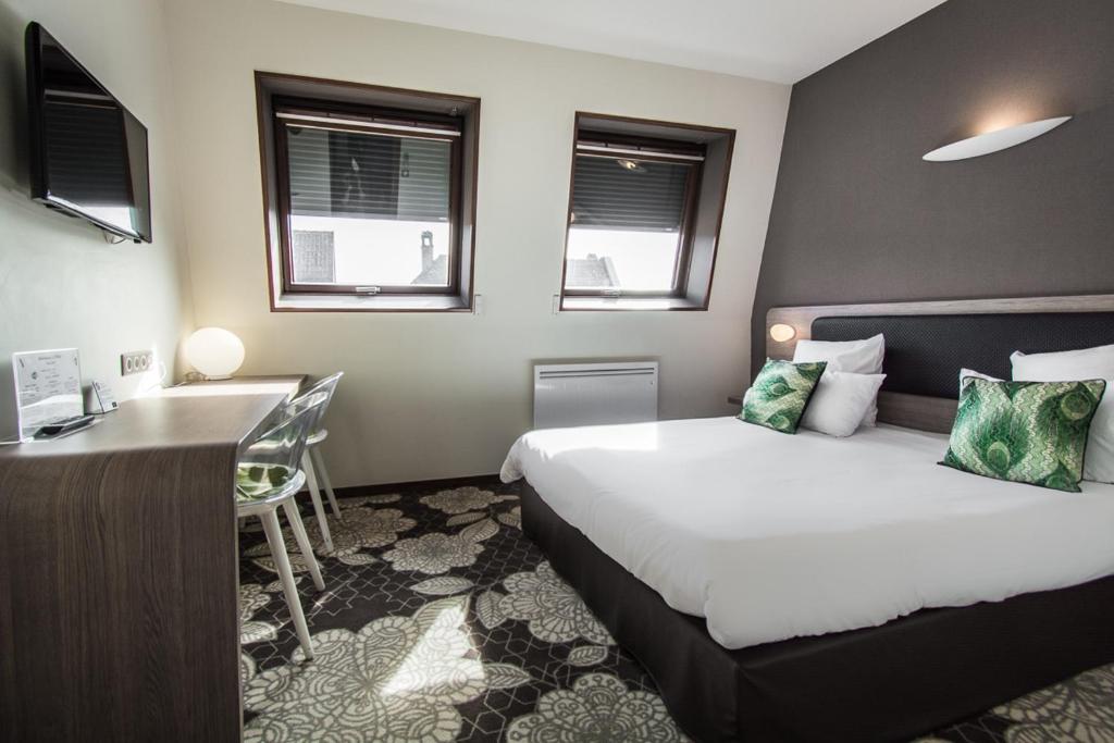 Postel nebo postele na pokoji v ubytování Hôtel Restaurant Vaillant proche Europapark Rulantica