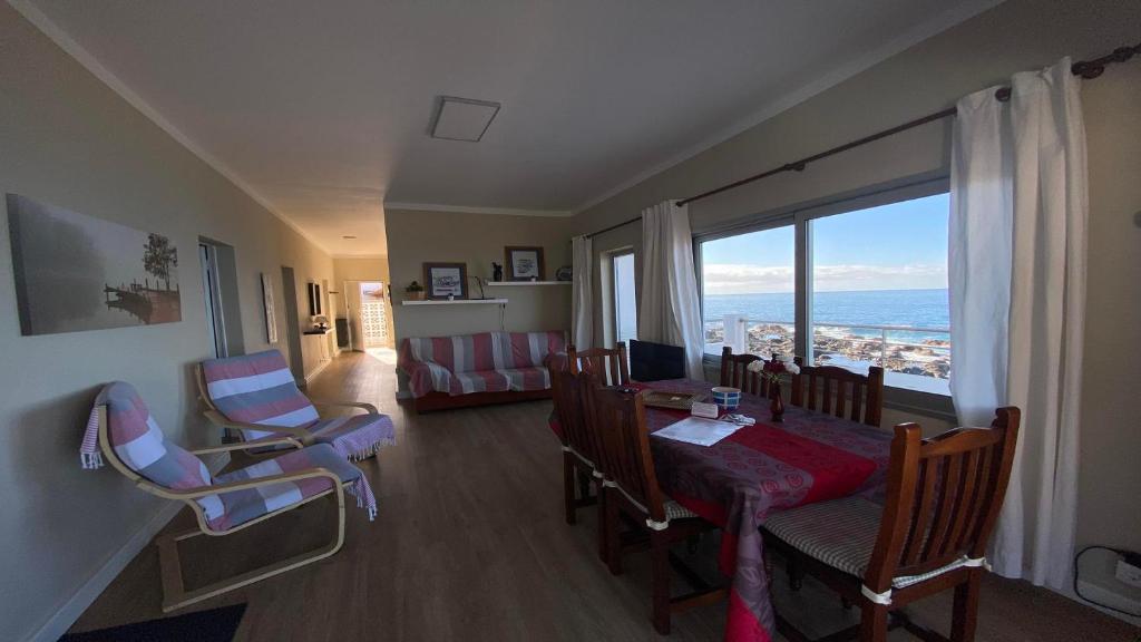 a living room with a table and chairs and a large window at Casa Camilo I in Valle Gran Rey