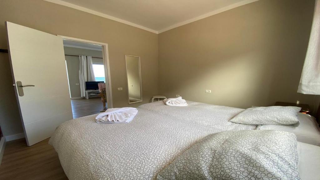 a bedroom with a bed with two towels on it at Casa Camilo I in Valle Gran Rey