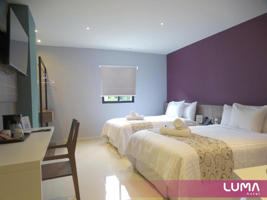 Postel nebo postele na pokoji v ubytování Hotel Luma by Kavia