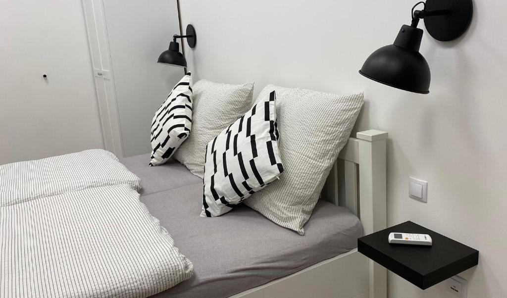 Posteľ alebo postele v izbe v ubytovaní Hősök Tornya Apartman