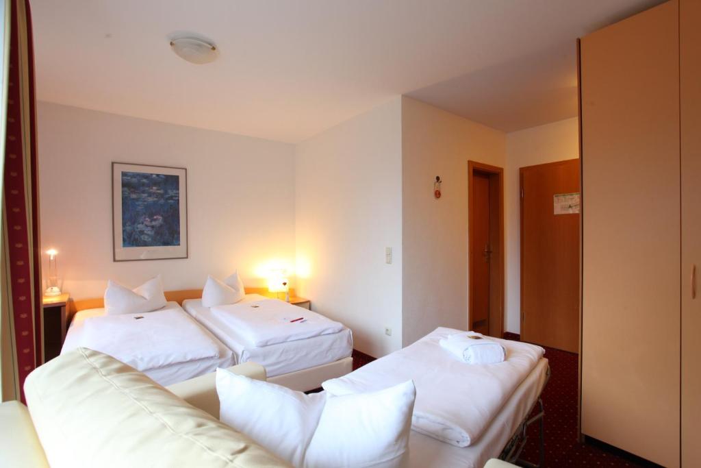 Postel nebo postele na pokoji v ubytování Andante Hotel Erding