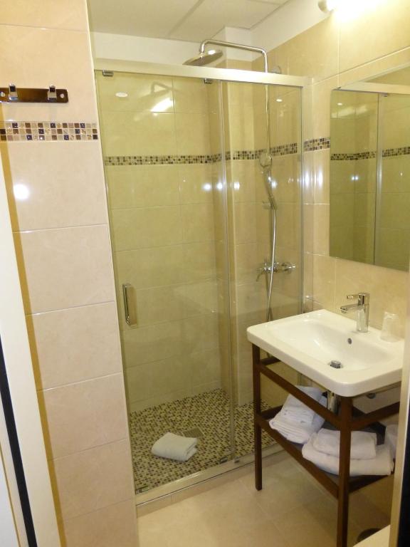 Koupelna v ubytování Hotel Capitole