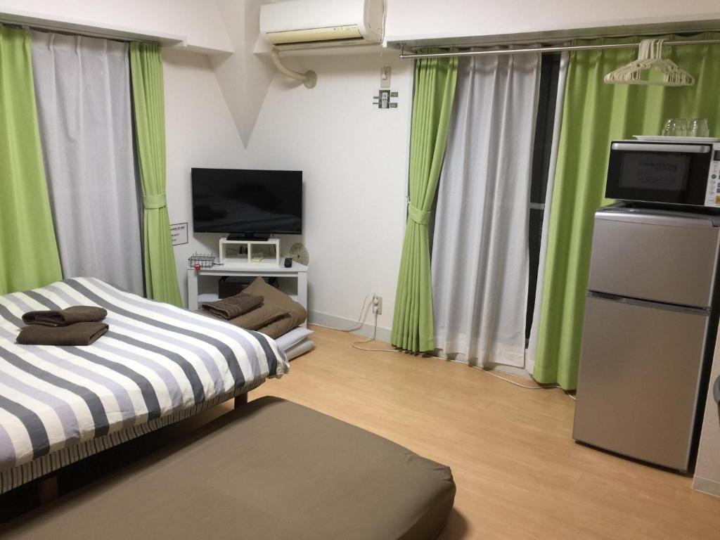 TV a/nebo společenská místnost v ubytování Isshuku Ryokan Asakusabashi - Vacation STAY 17365v