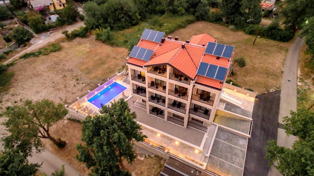 an aerial view of a house with solar panels on it at Luxury Apartments Queen in Petrovac na Moru