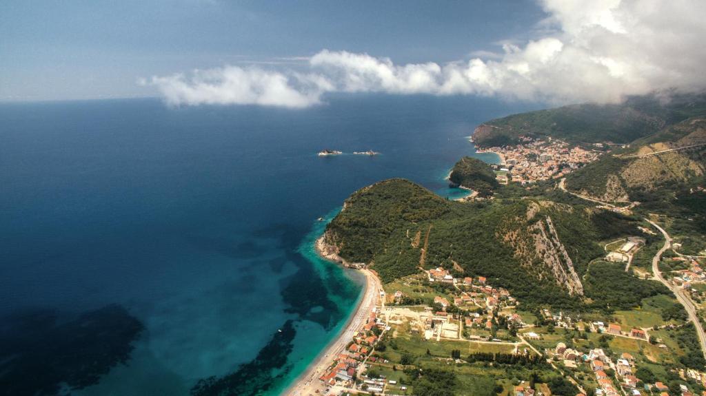 an aerial view of the beach and the ocean at Luxury Apartments Queen in Petrovac na Moru