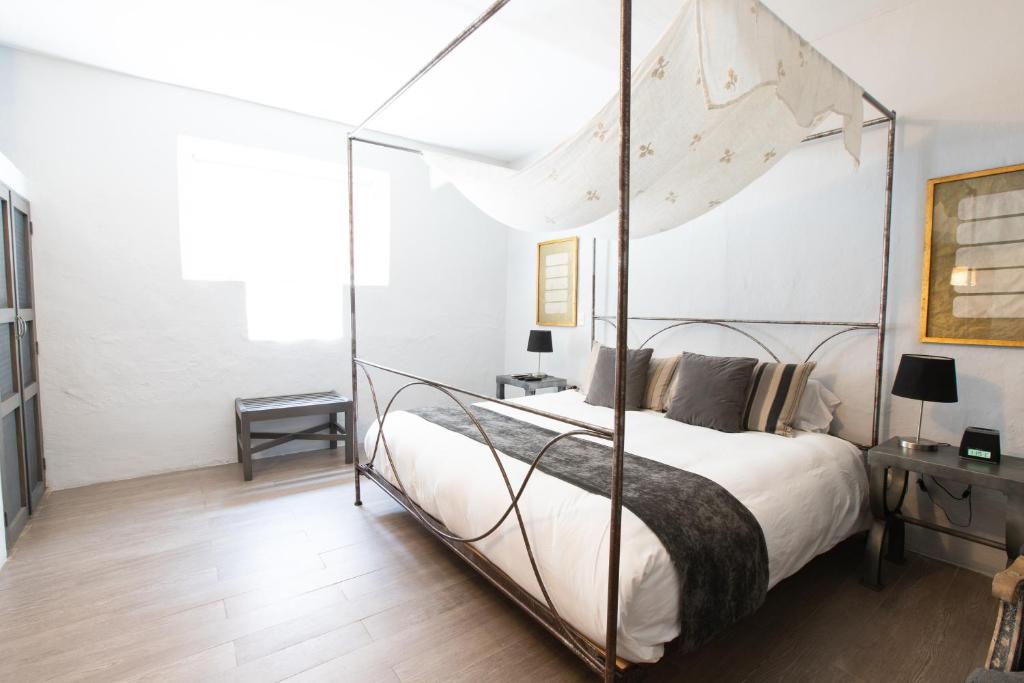 Postel nebo postele na pokoji v ubytování Hotel Boutique El Palomar