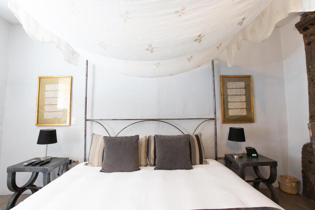Postel nebo postele na pokoji v ubytování Hotel Boutique El Palomar