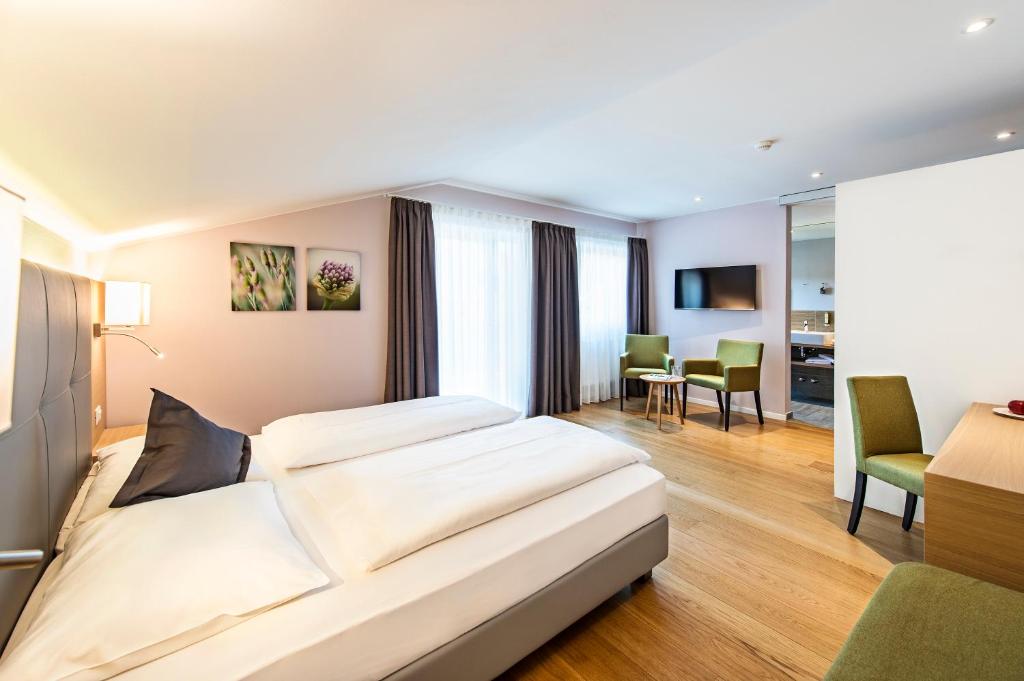 Postel nebo postele na pokoji v ubytování Hotel Jardis
