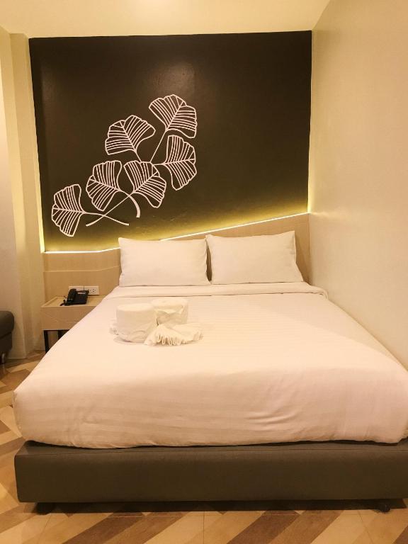 Postel nebo postele na pokoji v ubytování SJ Miracle Hotel