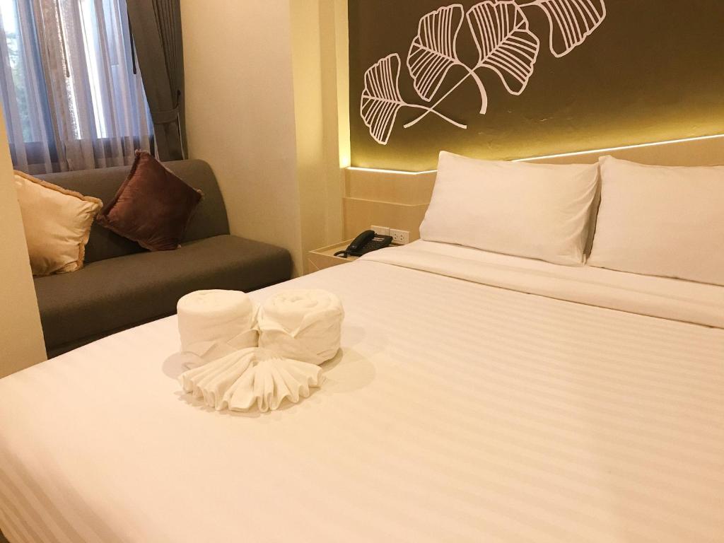 Postel nebo postele na pokoji v ubytování SJ Miracle Hotel