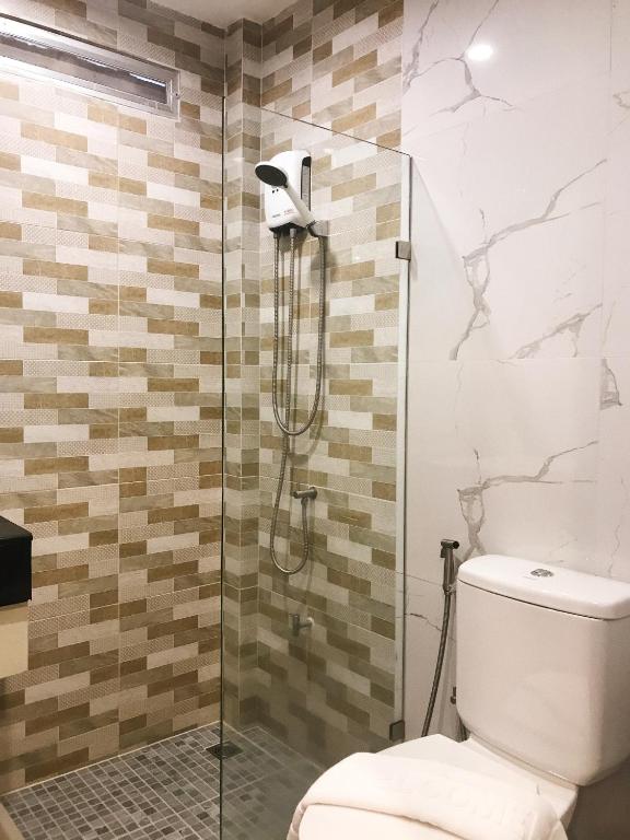 Koupelna v ubytování SJ Miracle Hotel
