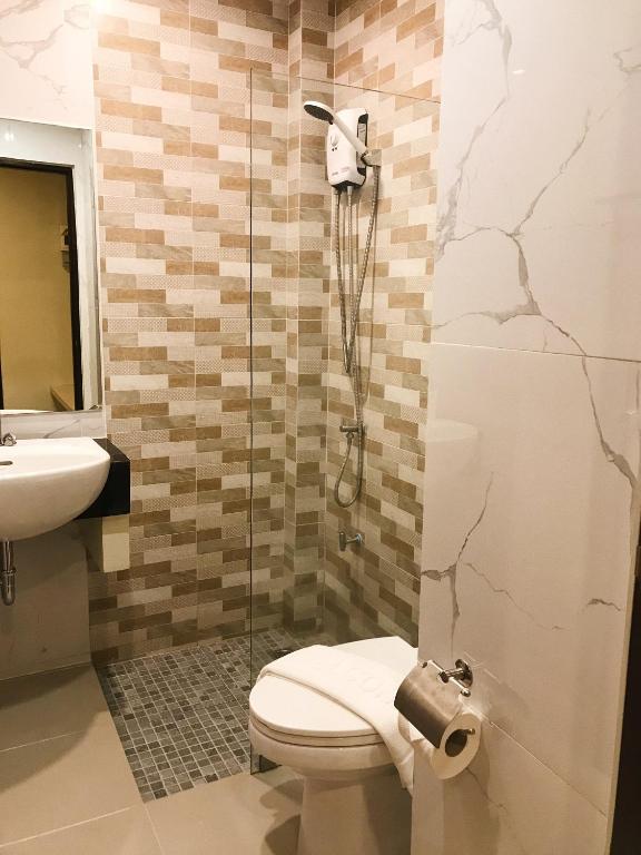 Koupelna v ubytování SJ Miracle Hotel