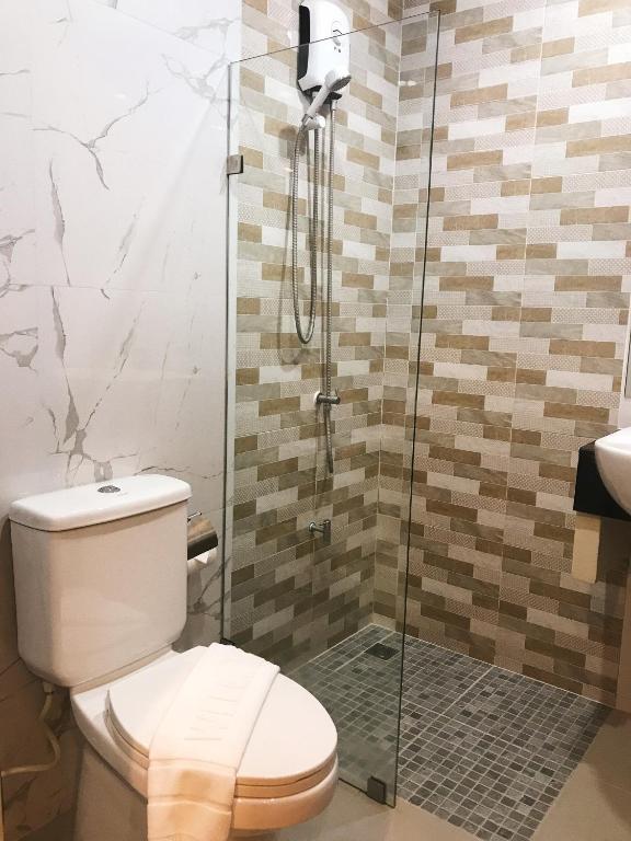 Koupelna v ubytování SJ Miracle Hotel