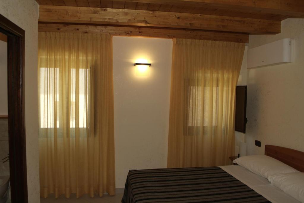 Posteľ alebo postele v izbe v ubytovaní Locanda Dal Sor Francesco