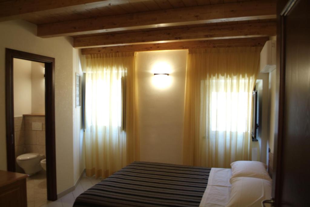 Posteľ alebo postele v izbe v ubytovaní Locanda Dal Sor Francesco