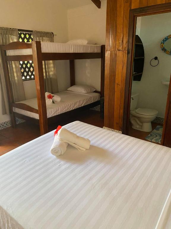 Postel nebo postele na pokoji v ubytování Macao Beach