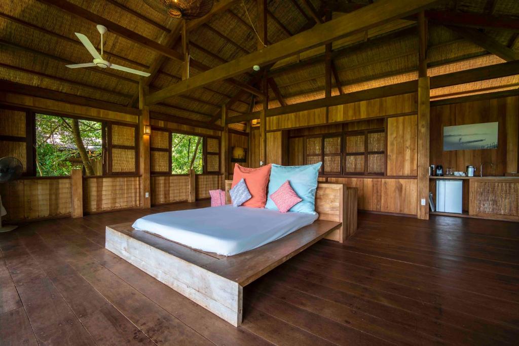 Postel nebo postele na pokoji v ubytování Mango Bay Resort