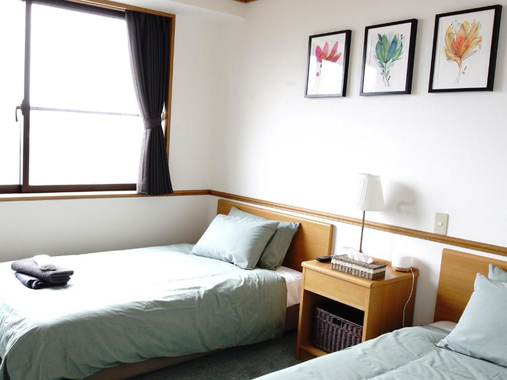 Postel nebo postele na pokoji v ubytování Refre Hotel