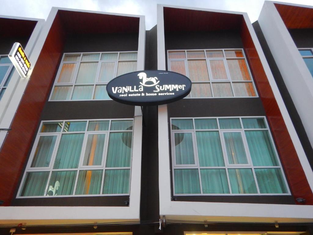 a building with a sign on the front of it at Baan Vanilla Summer Hua Hin in Hua Hin