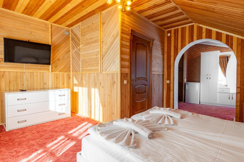 Postel nebo postele na pokoji v ubytování Zeleniy Bir