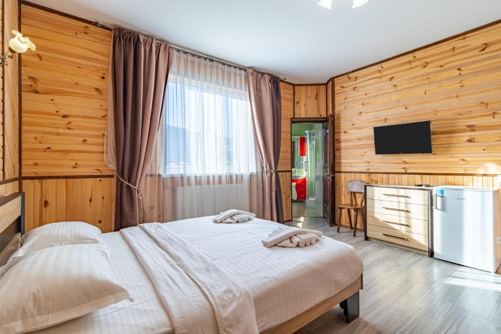 Postel nebo postele na pokoji v ubytování Zeleniy Bir